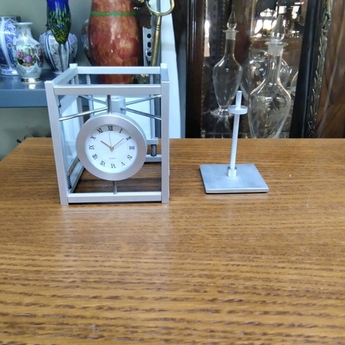 Quartz table clock silver color rotating, like new