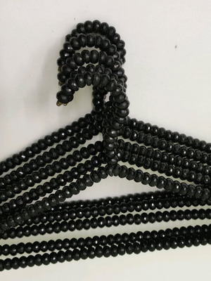 Set of 5 clothes hangers with black beads like new