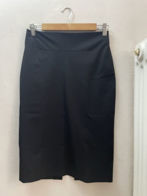 MNG midi black skirt like new, tight fit with back slit