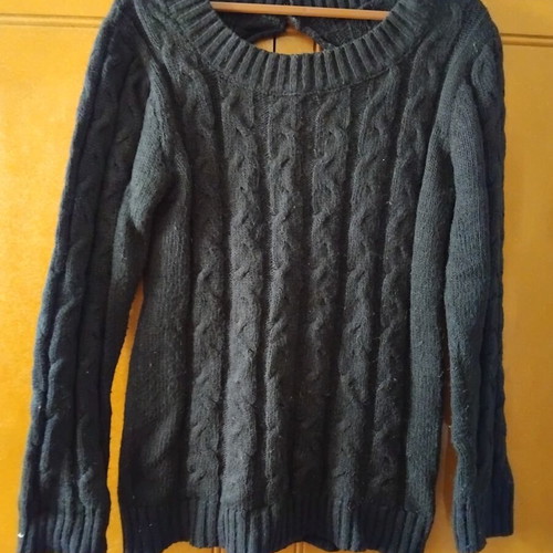 Black knitted sweater with cable design and back opening used, size L