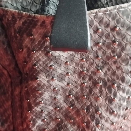 Snakeprint backpack used, grey with snake pattern and studs