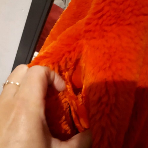 Stradivarius orange fur like new, with torn pocket lining