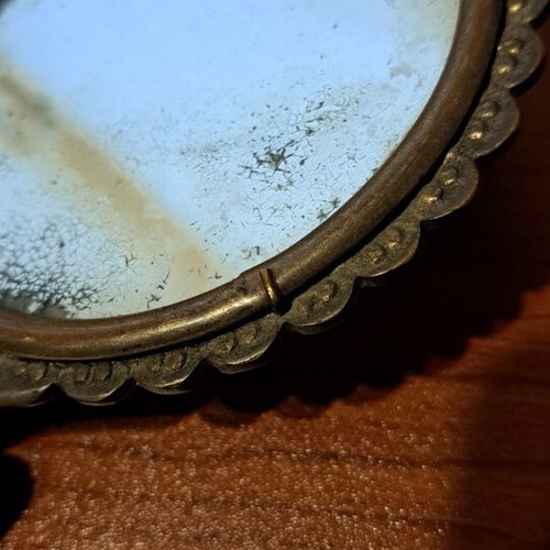 Brass hand mirror used with embossed peacock decoration