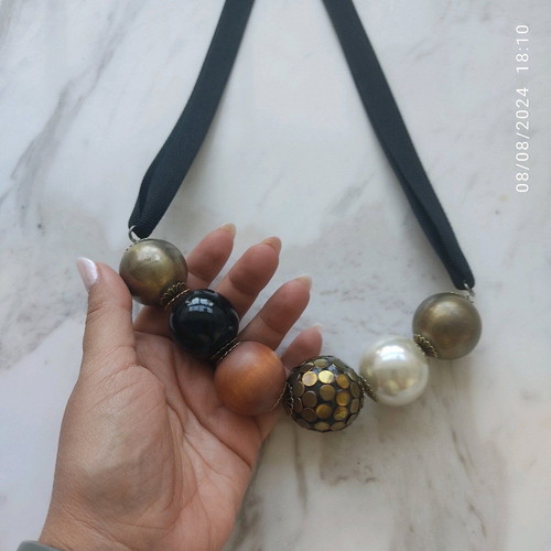 Accessorize necklace used with black thick ribbon and large beads
