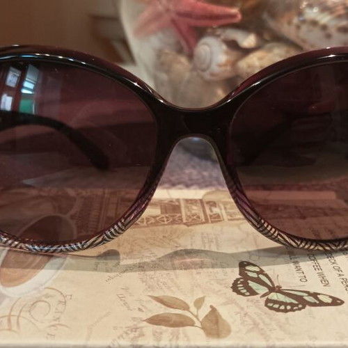 Women's oversized purple sunglasses with gold details