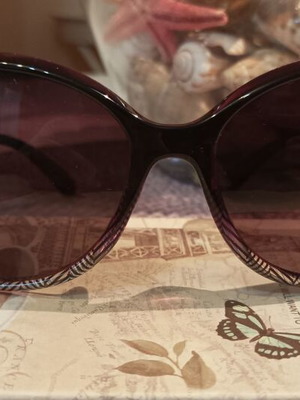 Women's oversized purple sunglasses with gold details