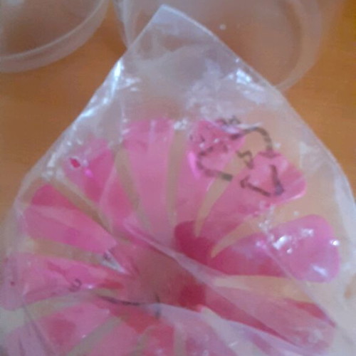 Tupperware product set new with collectible spatula and small cups
