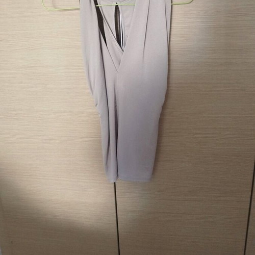 Sleeveless blouse with twisted design beige, like new, sizes S/M