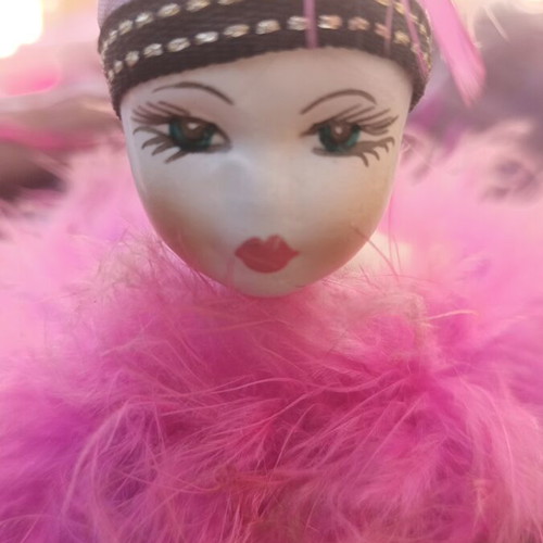 Clay jewelry box used with pink base and black top with Charleston doll feather