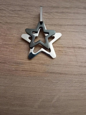 Star pendant made of steel like new, silver and black