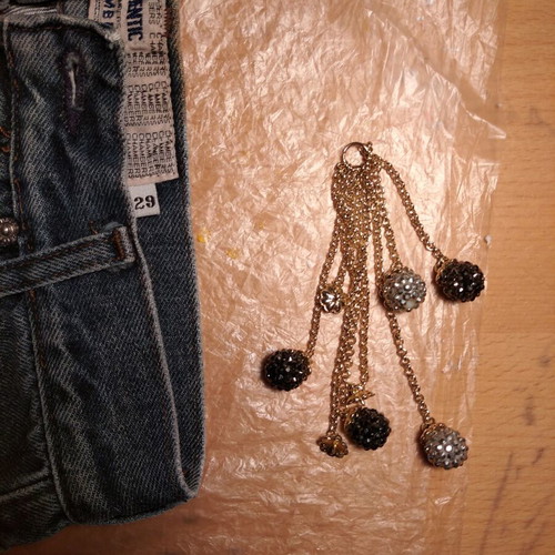 Hanging accessory with chains and balls with rhinestones