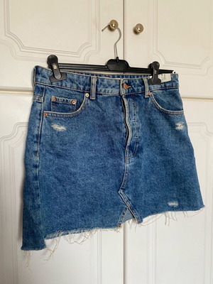 Blue denim skirt with tears like new