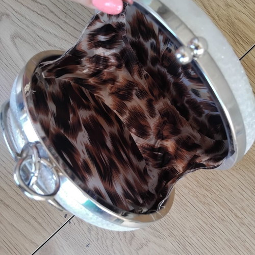 Round silver evening clutch bag with rhinestone ring handle used