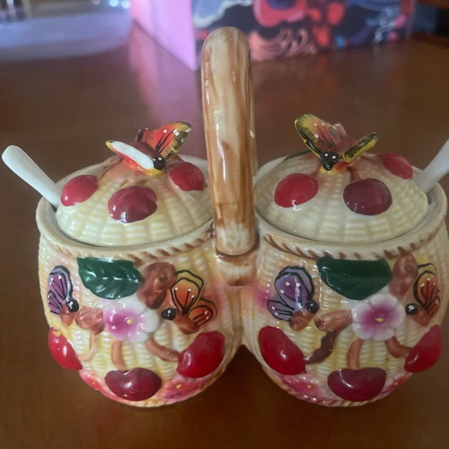 Ceramic jam pots used with spoons and decorative butterfly