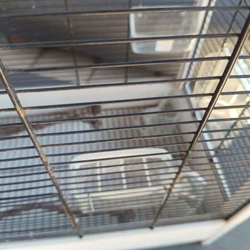 Wooden birdcage used with steel bars and plastic door