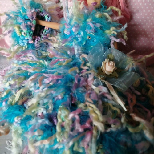 Doll with handmade dress and hat used