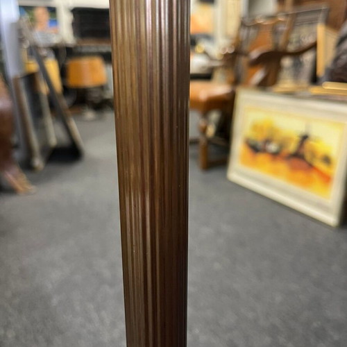 Vintage floor lamp used with ornate metal base and pleated fabric shade