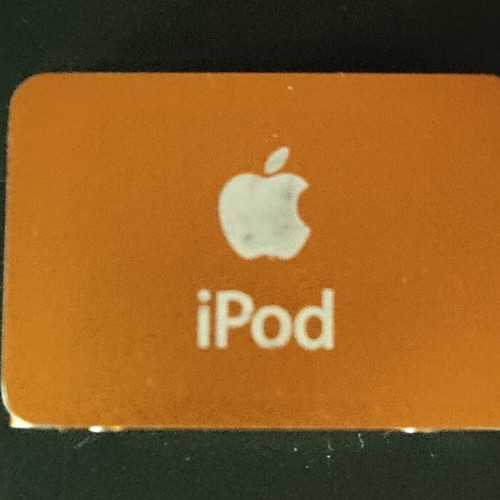 Apple iPod Shuffle 2nd Gen orange with dock, cable and headphones used