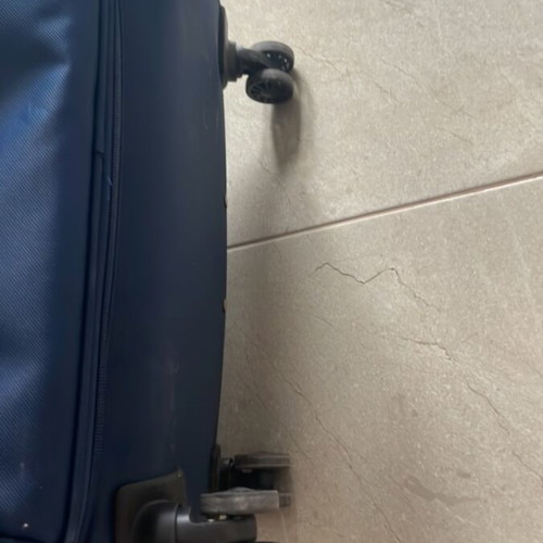 Large suitcase like new, blue, with 360-degree wheels and lock system