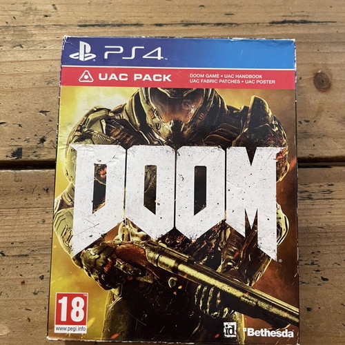 Doom PS4 deluxe edition with UAC pack, like new
