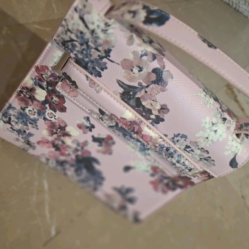 Handbag like new, pink with floral pattern, multiple pockets and strap
