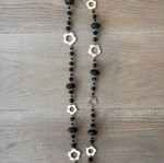 Long necklace like new with black beads and mother of pearl flower decorations