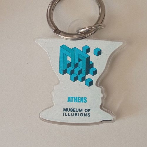 Museum of Illusions keychain used, white