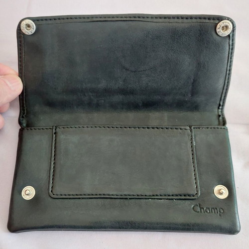 Black leather tobacco pouch used with paper holder
