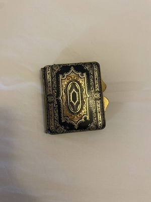 Vintage metal powder compact with mirror, used, black and gold enamel
