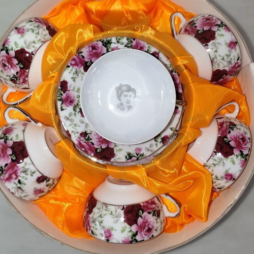 Vintage porcelain tea cups set with floral rose pattern and lithophany