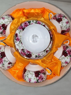 Vintage porcelain tea cups set with floral rose pattern and lithophany
