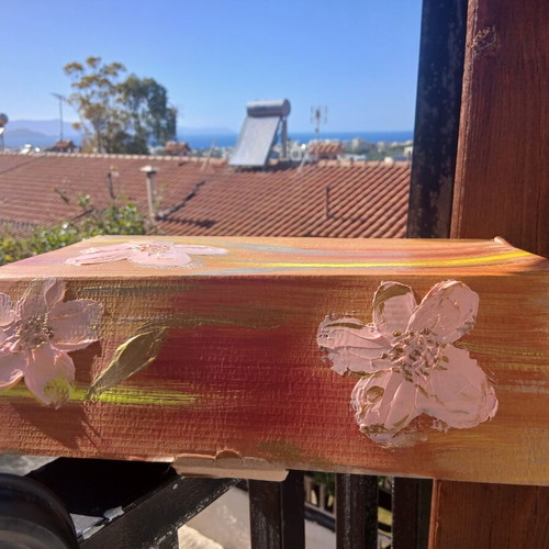 Handmade beeswax candles in decorative box with herbs and oils
