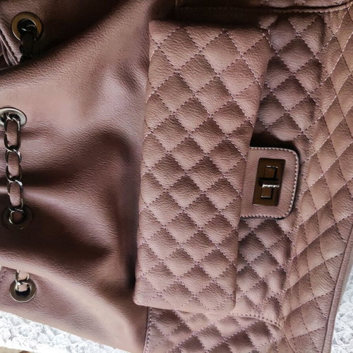 Backpack like new with quilted texture and handles