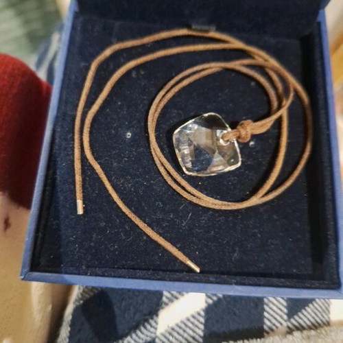 Swarovski necklace like new, transparent with brown cord