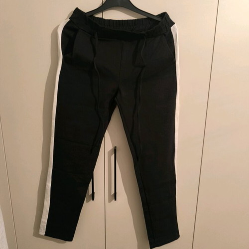 sweatpants with a white stripe on the side and an elastic waistband