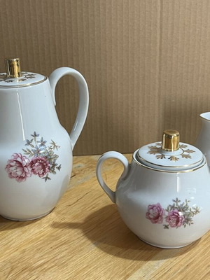 Porcelain tea set used with floral pattern, teapot, creamer, sugar bowl