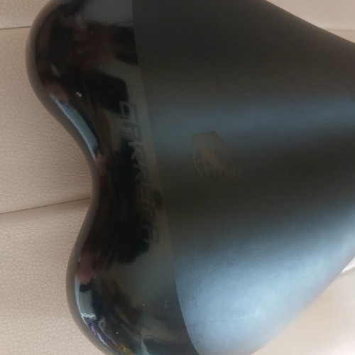 Carrera bicycle saddle like new with integrated rail clamp black