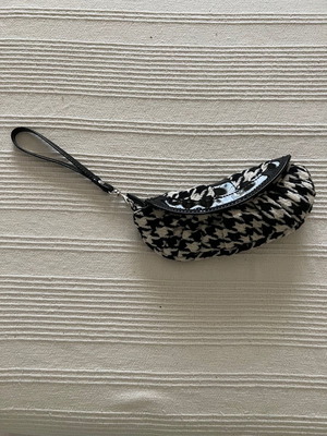 Accessorize wrist bag like new fabric and patent details