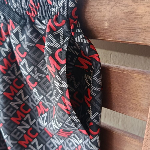 McKenzie Shorts Swimwear new, black with red print, size 12-13 years
