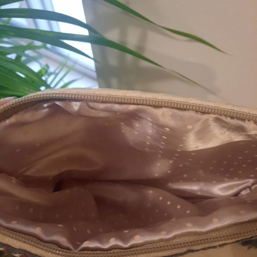 Handmade handbag used with gray tassels and golden details