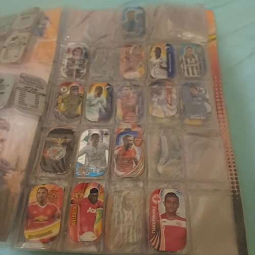 Panini metal tags album like new, contains about 80 metallics