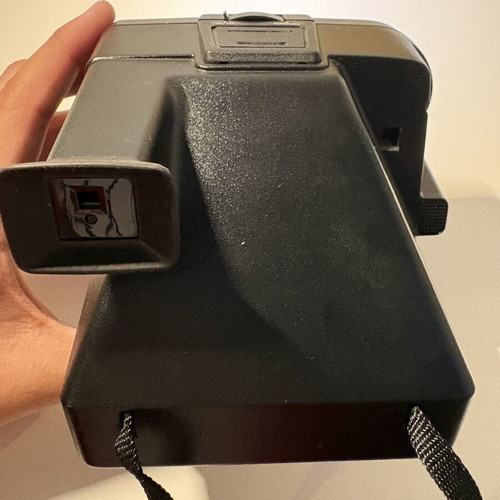 Polaroid Sonar AF 5000 instant camera with 8-frame film pack