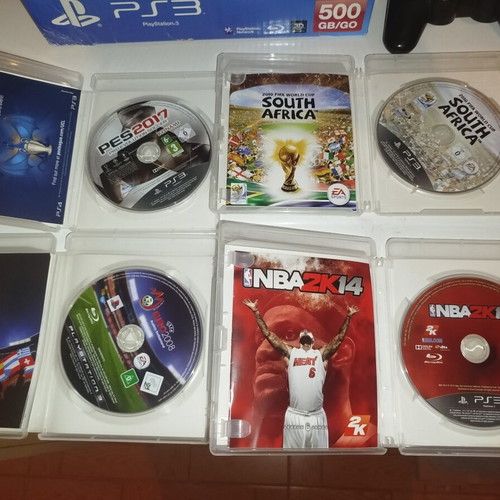 PS3 Super Slim 12GB console with 4 games and 3 controllers