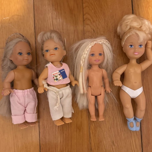 Barbie hairstyling head with small Shelly or Kelly dolls