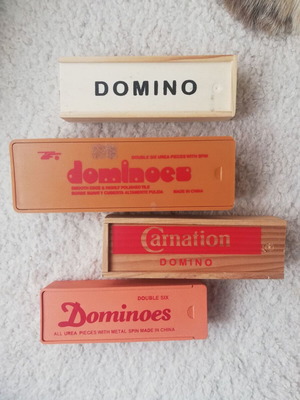 Domino sets used, four boxes with wood and plastic pieces