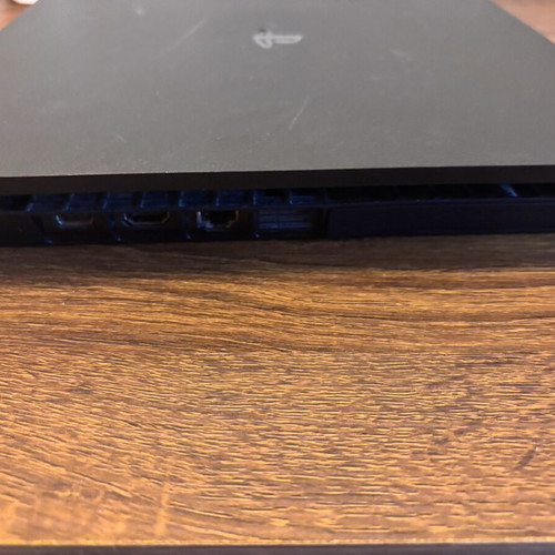 Sony PlayStation 4 Slim 500GB console with controllers