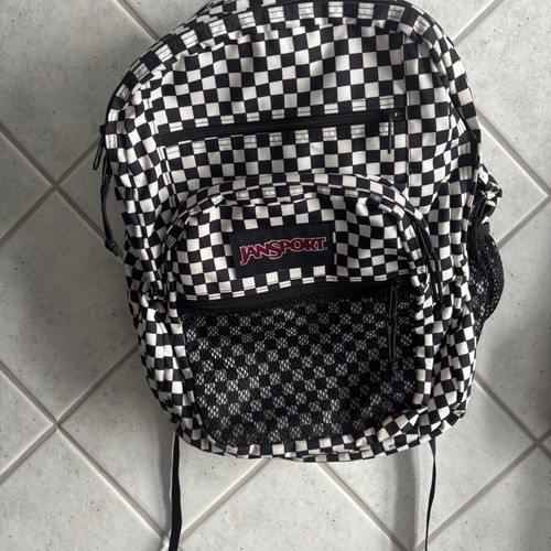Jansport black and white checkerboard backpack with laptop compartment