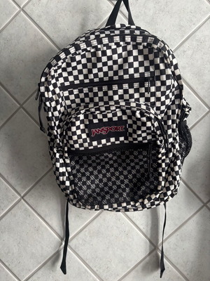 Jansport black and white checkerboard backpack with laptop compartment