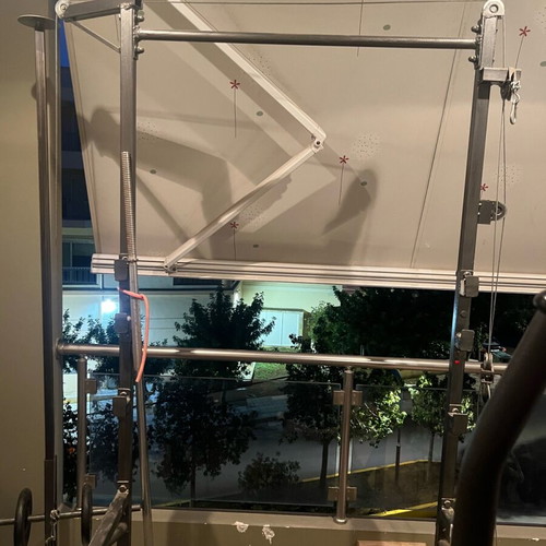 Training rack with barbell and pulley system
