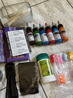 Tattoo supply kit with cartridges, inks, and accessories
